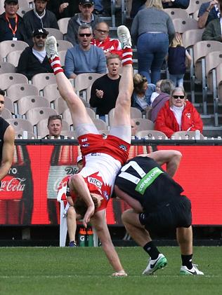Gary Rohan tumbles over Sam Rowe. Picture: Wayne Ludbey
