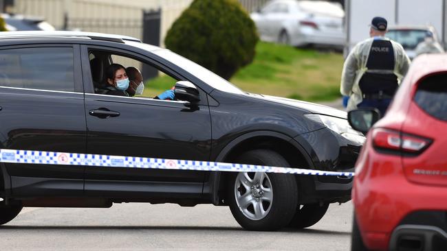 People were seen sitting in cars while the emergency officials worked. Picture: NCA NewsWire/Joel Carrett