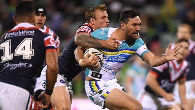Jordan Rapana is tackled by Jake Friend.