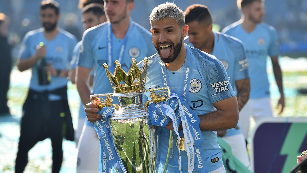 Manchester City's Sergio Aguero lifts the Premier League trophy