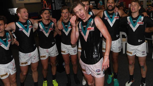 Todd Marshall and the Power players sign the club song. Picture: AAP Images