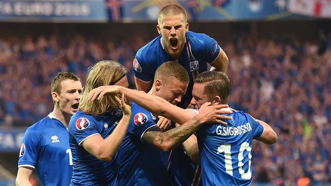 Iceland teammates celebrate Iceland's first goal