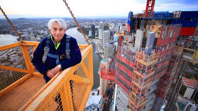 Harry Triguboff, then aged 78, taking a crane ride 280m up to inspects his 77-storey high-rise apartment tower Soleil, overlooking the Brisbane River.