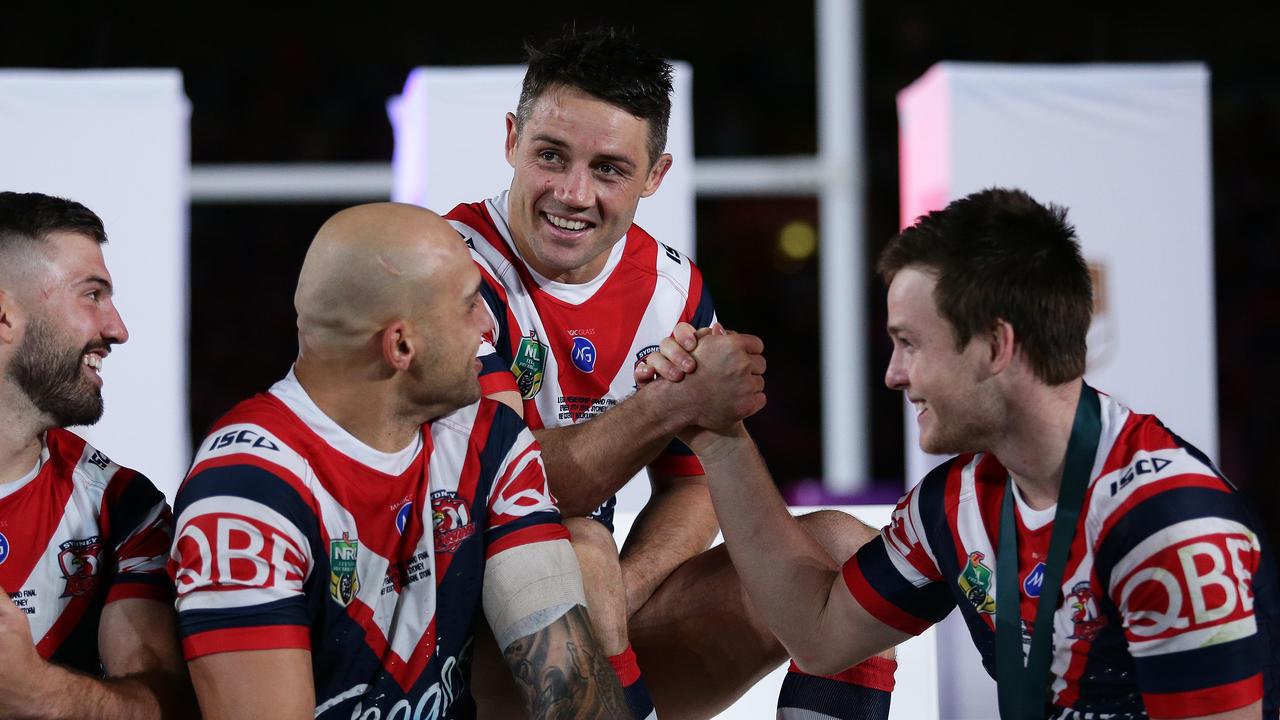 Roosters Cooper Cronk and Luke Keary celebrate victory after the 2018 NRL grand final 