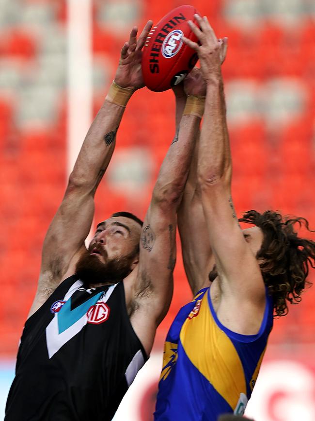 Charlie Dixon soars to mark in front of Eagles ruckman Tom Hickey.