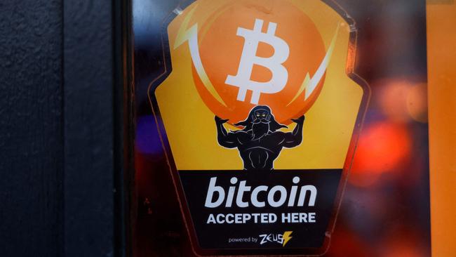 A store in New York City promoting its acceptance of bitcoin as a form of currency. Picture: Michael M. Santiago)