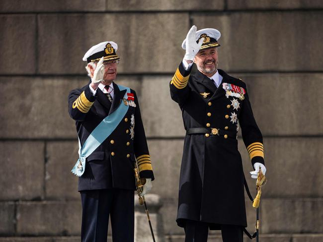 King Frederik X of Denmark and King Carl XVI Gustaf of Sweden wave upon arrival to the Royal Palace in Stockholm, Sweden. Picture: AFP