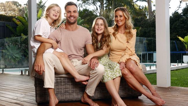 Ryan with his wife Kara and their kids Jesse and Remi. He’s much less complacent about head knocks now than he was when he was playing football. Picture: Richard Dobson