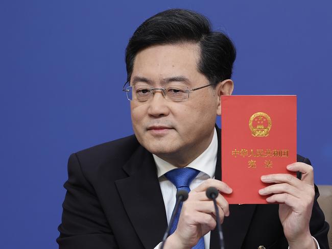 BEIJING, CHINA - MARCH 07: China's foreign minister Qin Gang  holds a China's constitution during a press conference at Media Center on March 07, 2023 in Beijing, China. Foreign Minister Qin Gang answered questions from Chinese and foreign journalists on China's foreign policy and foreign relations. (Photo by Lintao Zhang/Getty Images)