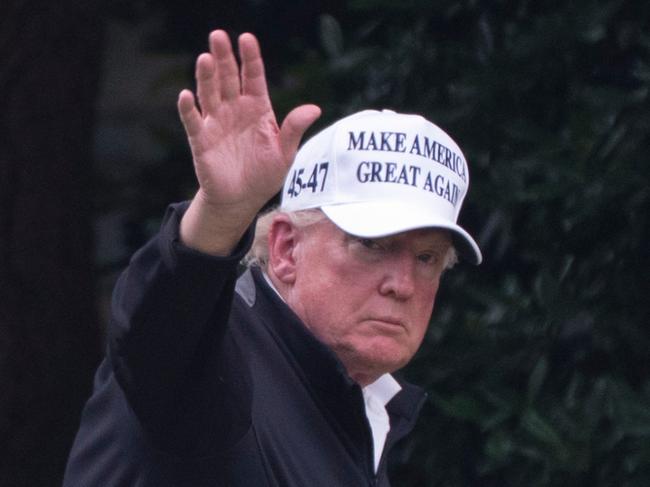 President Donald Trump, right, walks toward the Oval Office as he returns to the White House with Bryson DeChambeau, winner of the 2024 U.S. Open, after playing golf, Sunday, June 1, 2025. (AP Photo/Manuel Balce Ceneta)
