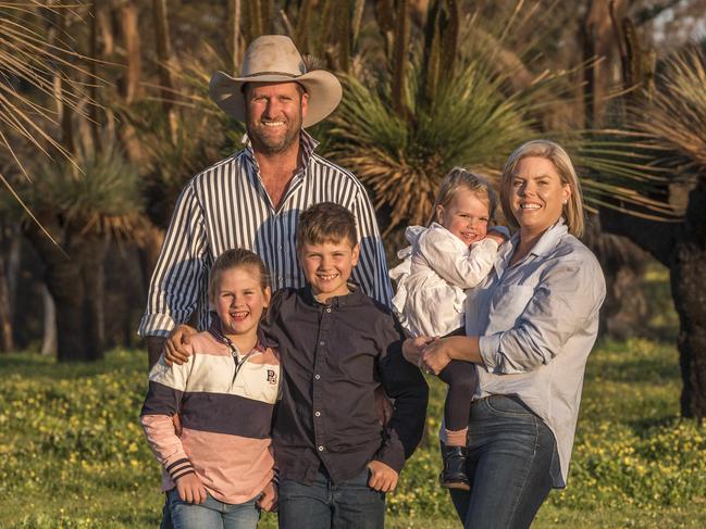 01/10/2020: Kangaroo Island, the Wurst family. Pictured are Steph and Tom Wurst with their kids Jack, Georgia and toddler Charlotte. The backdrop is native vegetation on their family farm near Stokes Bay, burned black in January and now fiercely regenerating. PIC: Sean McGowan