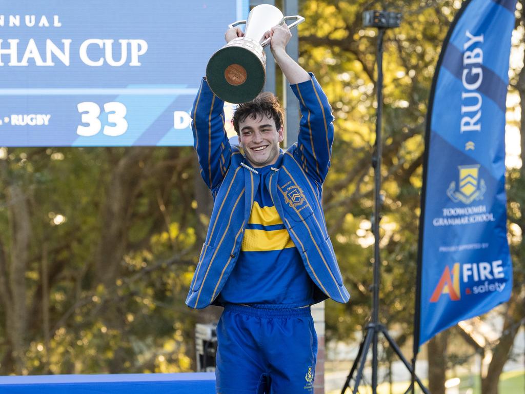 TGS 1st XV captain George Griffiths lifts the O'Callaghan Cup.