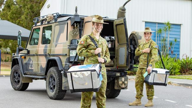 Adele Brown and Brehndan Thompson from Gallipoli Barracks, Enoggera, prepare to head out on a delivery run for Mitchelton Meals on Wheels.