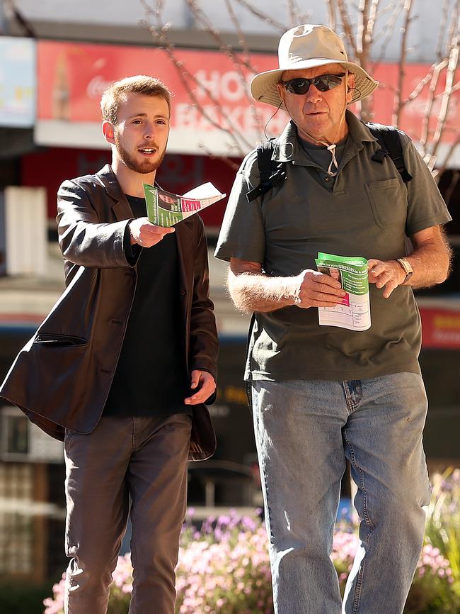 Joseph Nicita (left) wears more conventional clothing yesterday while campaigning in Hornsby.