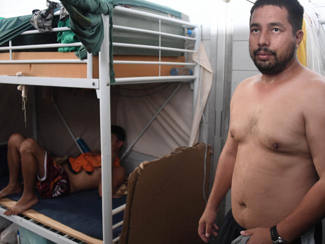 Asylum seekers in one of the searing hot sleeping areas that they can't use now as there is no power at the Lombrum detention centre. Picture: Brian Cassey