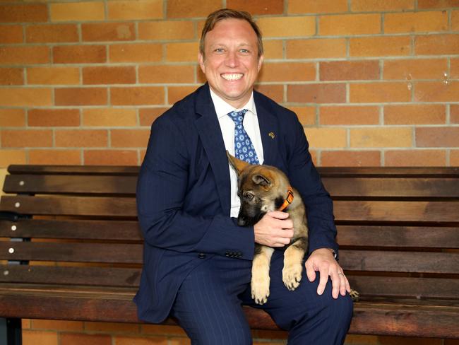 Queensland Premier Steven Miles pictured with Police puppy Kracken (10 weeks old) while inspecting the new Youth Remand Centre at Wacol. Wacol Wednesday 27th March 2024 Picture: David Clark