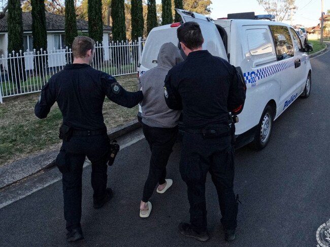 One of the men being arrested during the sweep. Picture: NSW Police