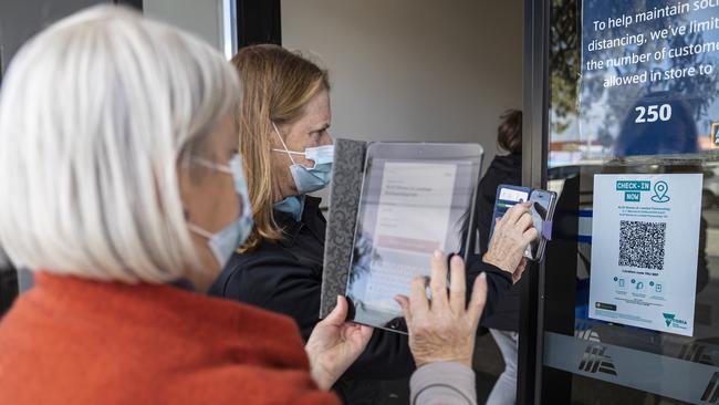 Customers check in at a supermarket in Doncaster, Melbourne. Picture: Daniel Pockett/NCA NewsWire