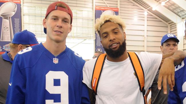 Brad Wing and Odell Beckham Jr. and at a charity event.