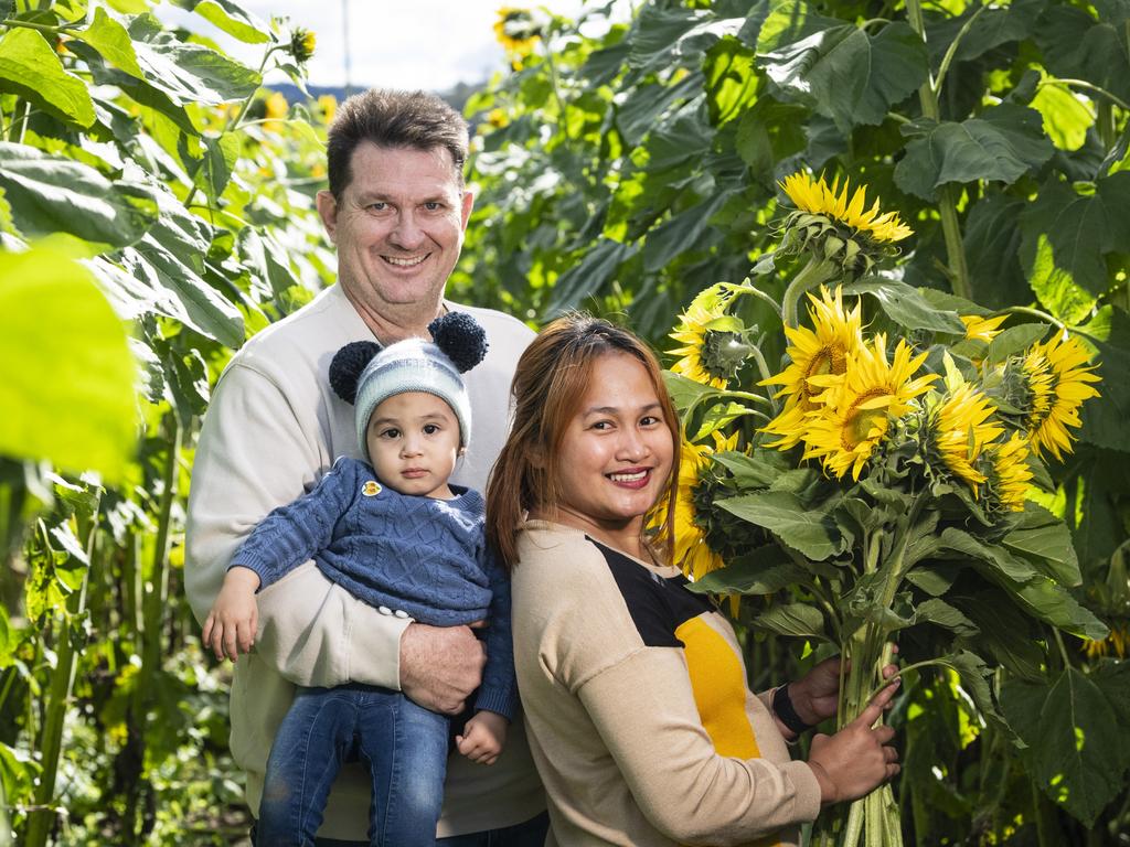 Mark and Kimmy Hooper with Elijah at the picnic with the sunflowers event hosted by Ten Chain Farm, Saturday, June 8, 2024. Picture: Kevin Farmer