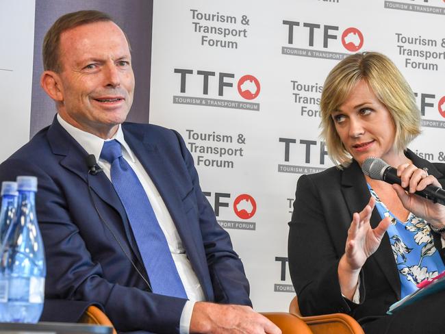 Member for the seat of Warringah Tony Abbott with Independent candidate for the Federal Seat of Warringah Zali Steggall during the Tourism & Transport Forum?s 2019 Leadership Summit in Sydney, March 8, 2019. (AAP Image/Peter Rae) NO ARCHIVING