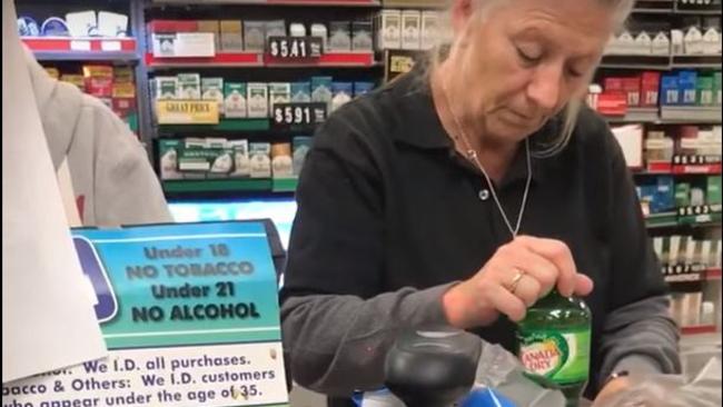 The woman in the black shirt only manages to bag one soda bottle before zoning out once more. Picture: Fair West