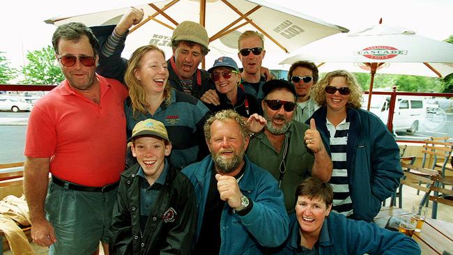 Skipper David Pescud (front, centre), with Travis Foley (front, left) and the rest of the crew from the yacht Aspect Computing at Constitution Dock, Hobart after they completed the 1998 Sydney to Hobart.