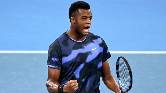 Giovanni Mpetshi Perricard of France reacts after a point during his men's singles match against Frances Tiafoe of the US at the Brisbane International tennis tournament in Brisbane on January 2, 2025. (Photo by William WEST / AFP) / --IMAGE RESTRICTED TO EDITORIAL USE - STRICTLY NO COMMERCIAL USE--