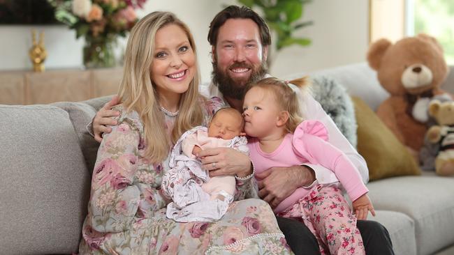 Charli Robinson and Liam Talbot with their newborn daughter Theadora and Kensington, 18 months. Picture: Peter Wallis