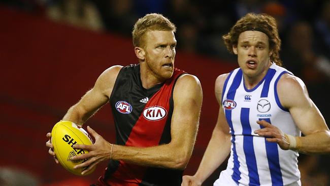 Dustin Fletcher strides clear of North Melbourne’s Ben Brown.