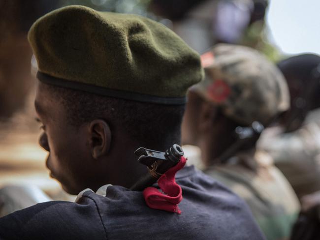 Child soldiers sit as they attend their release ceremony. Picture: AFP PHOTO/Stefanie Glinski