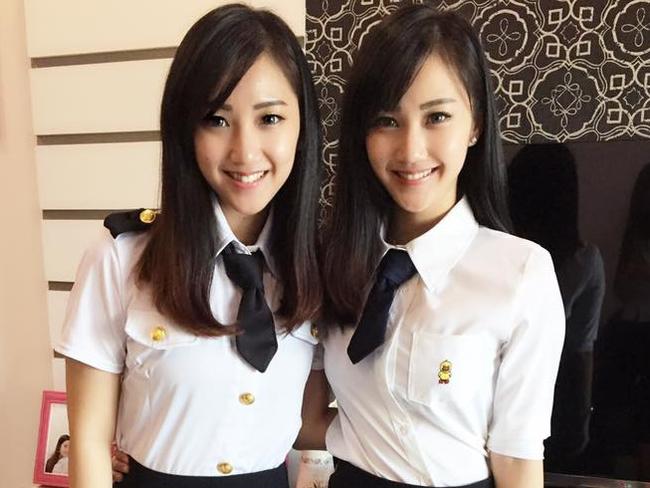 Model Qi Min Lan with her with her twin sister. Picture: Facebook