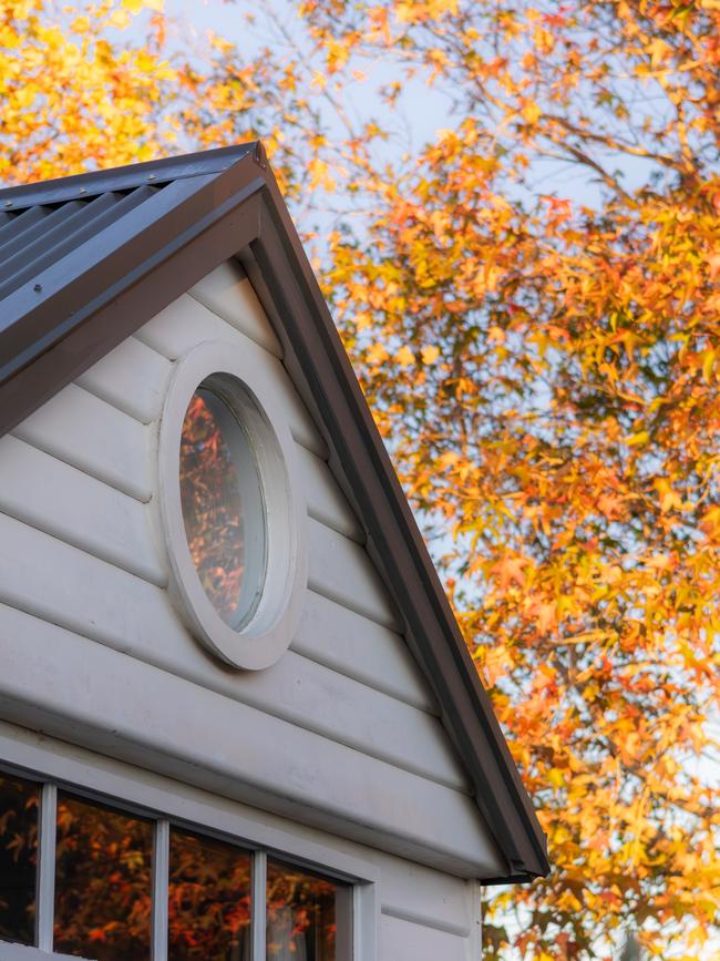The charming white weatherboard exterior of Townhouse and Loft. Picture: Willow & Sage Photography