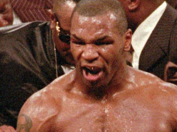 Mike Tyson, center, reacts to the crowd as he leaves the ring following his bout with WBA heavyweight champion Evander Holyfield at the MGM Grand Garden in Las Vegas, in this June 28, 1997 file photo. Tyson was disqualified after biting Holyfield's ear twice in the third round. A report by a team of psychiatrists who examined the former heavyweight champion portrays him as lacking in self-esteem and depressed to the point that he has been taking anti-depressant drugs in the months following the Holyfield fight. However, the report says the former heavyweight champion is 'fit to box again.'' The report was ordered by the Nevada Athletic Commission as a requirement for Tyson in his attempt to regain his license. (AP). /boxing incidents