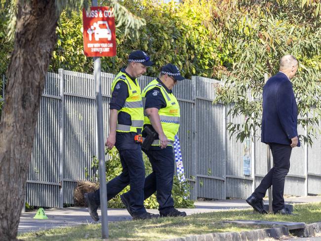 Officers probe the scene of the crash. Picture: Wayne Taylor