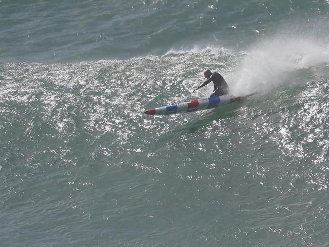 Gold Coast ocean athlete Phil Clayton rides a monster wave at Burleigh on Sunday. Picture: Instagram/@photowilba