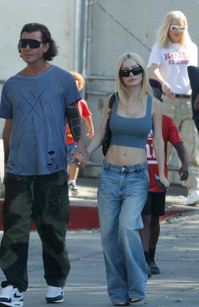 Avoiding an awkward run in, Gavin Rossdale and Gwen Stefani lookalike girlfriend Xhoana were seen walking with his ex wife Gwen Stefani in the background. Picture: Backgrid