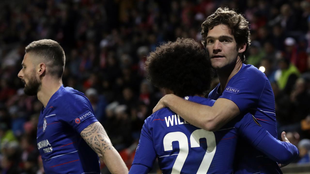 Chelsea's Marcos Alonso, right, celebrates with teammates.