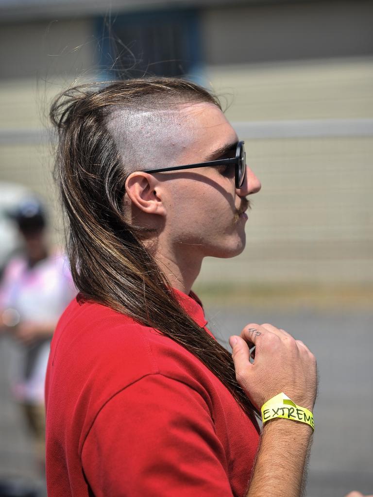 Participant are seen during Mulletfest, a special event designed to celebrate the hairstyle that's all about business at the front, party at the back, at Chelmsford Hotel in Kurri Kurri, NSW. (AAP Image/Perry Duffin) 