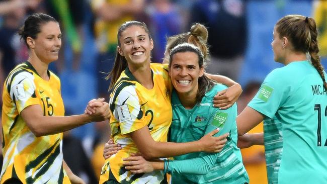 Australian players celebrate after victory over Brazil. Picture: AFP