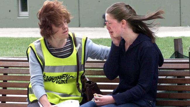 A counsellor comforts a shocked student at the Clayton campus of Monash University. Picture: Faith Nulley