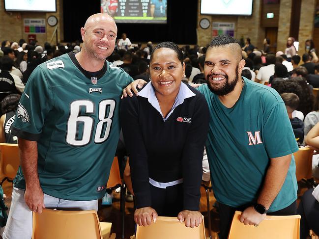 Condell Park High (L-R) Head PE Kieran Frappell, with former students Lusiana Roko and Jamie Ryan join the school to watch their old classmate, Philadelphia Eagles NFL star Jordan Mailata. He is one of two Australians playing in this years Super Bowl. Jane Dempster/The Australian.