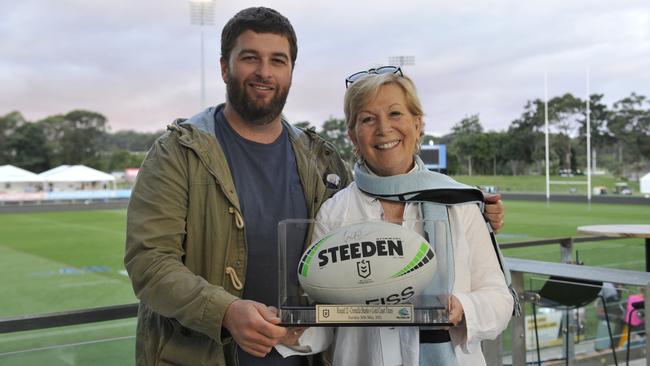 Calvin Wigg and Coffs Harbour Mayor Denise Knight with a signed match ball following the NRL Indigenous Round match between the Cronulla Sharks and the Gold Coast Titans at C.ex Stadium. It was the first NRL match to be played in Coffs Harbour. Photo: Tim Jarrett.