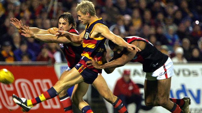 Scott Thompson peppers the goals against Essendon at Football Park.