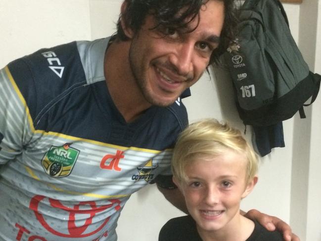 Johnathan Thurston with Guy Brennan, son of Gold Coast Titans coach Garth Brennan after a match at Penrith in 2016. Guy, now 12, is 10 here.