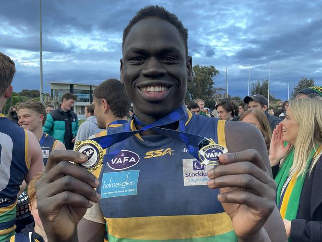 Ex-AFL player Tom Jok wins the Jock Nelson medal for best player afield.