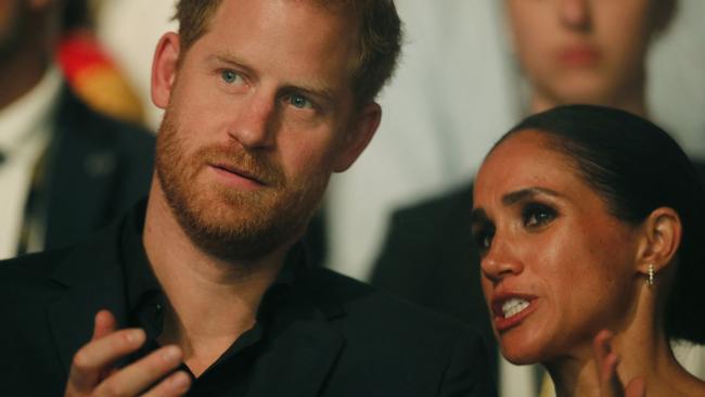 Harry, Duke of Sussex and patron of the Invictus Games (L), and his wife Meghan, Duchess of Sussex, attend the closing ceremony of the 2023 Invictus Games in Duesseldorf, western Germany on September 16, 2023. The Invictus Games, an international sports competition for wounded soldiers founded by British royal Prince Harry in 2014, was taking place from September 9 to 16, 2023 in Duesseldorf. (Photo by LEON KUEGELER / AFP)