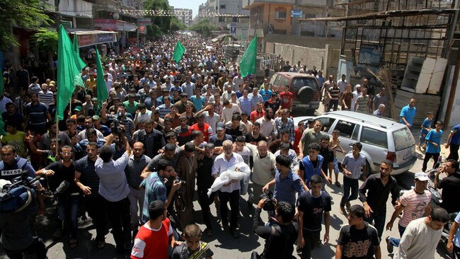 People marched in Gaza City during the funeral of the wife and infant son of Hamas’s military leader in August 2014. Picture: Zuma Press/WSJ