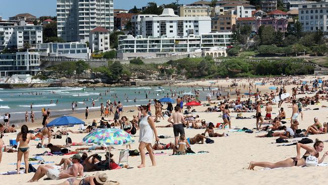 Thousands of beachgoers of all ages flocked to Bondi on Friday before it was closed on Saturday. Picture: AAP