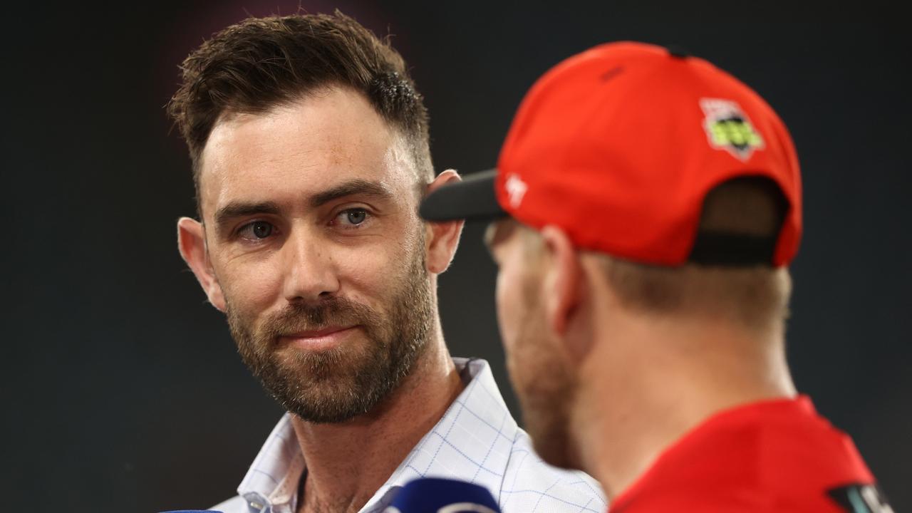 Glenn Maxwell is seen as he interviews Renegades captain Aaron Finch prior to the Men's Big Bash League match between the Melbourne Renegades and the Adelaide Strikers at Marvel Stadium, on January 24, 2023, in Melbourne, Australia. (Photo by Robert Cianflone/Getty Images)